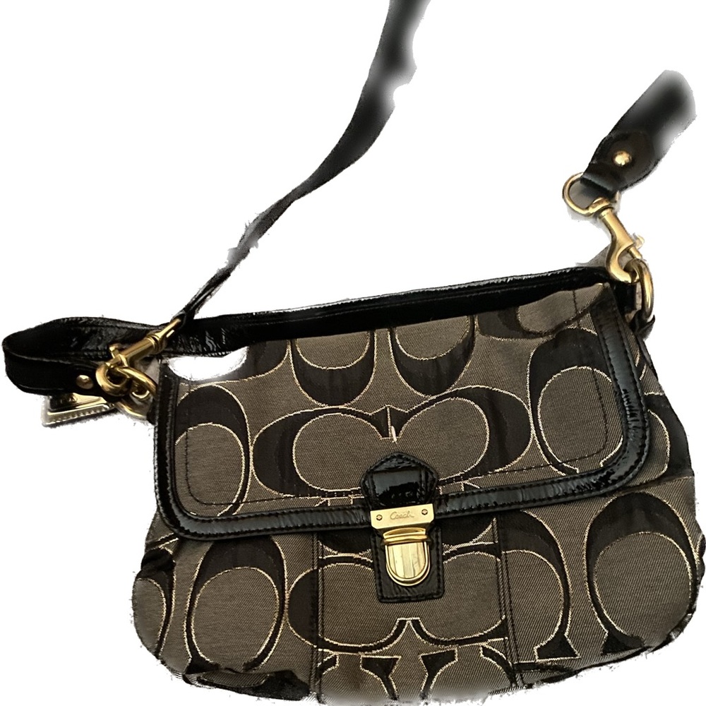 Coach crossbody bag. Very old but never worn. Removable straps. Nice bag.